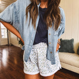 3/4 sleeve light wash chambray button down shirt with front pocket.