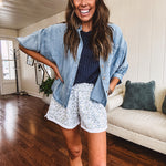 3/4 sleeve light wash chambray button down shirt with front pocket.