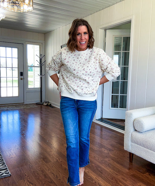 Soft, lightweight long sleeved crew in cream with dainty pink florals throughout.