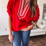 Cool red dolman style top with white and red gingham trim at the mock neck and yoke.