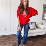 Cool red dolman style top with white and red gingham trim at the mock neck and yoke.