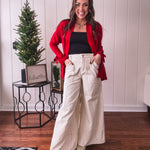 Wide leg button and zipper pants in ivory with black polka dots.