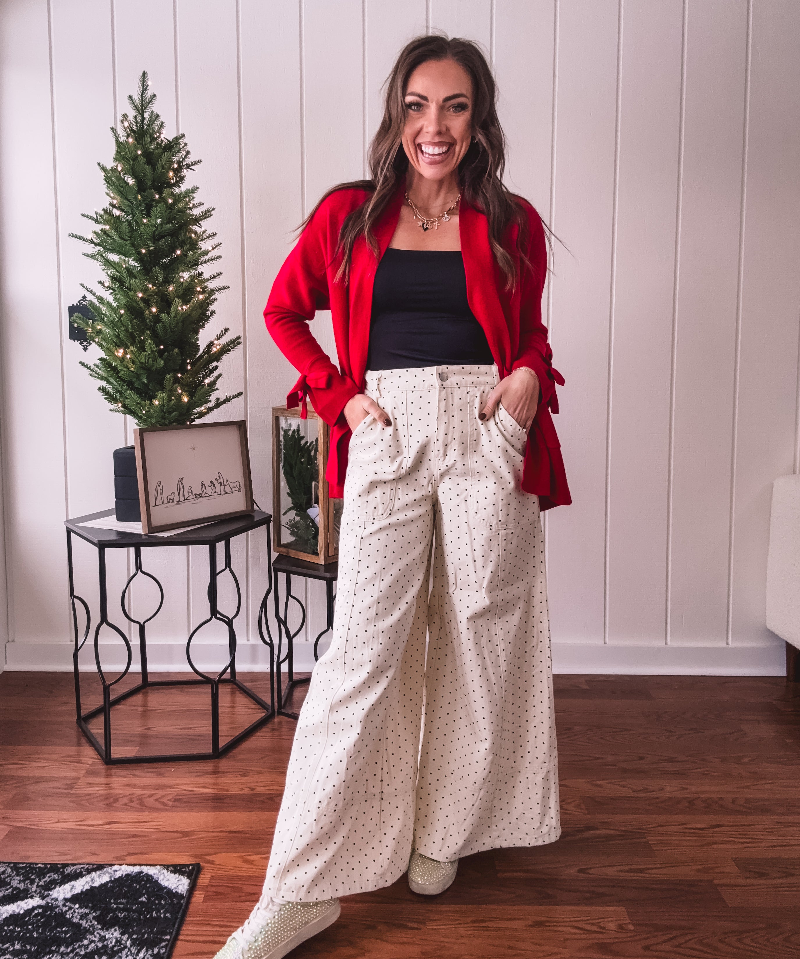 Wide leg button and zipper pants in ivory with black polka dots.