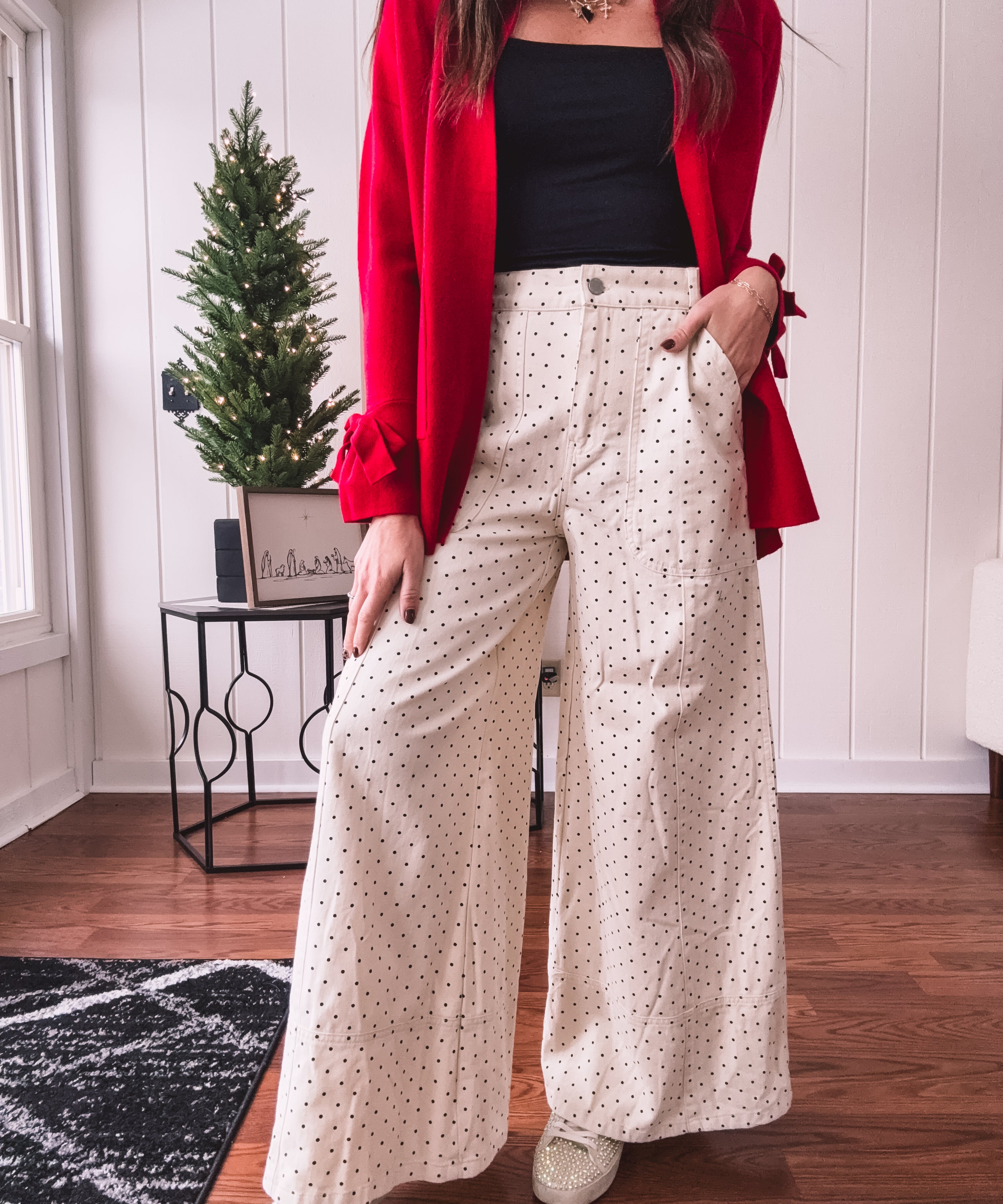 Wide leg button and zipper pants in ivory with black polka dots.
