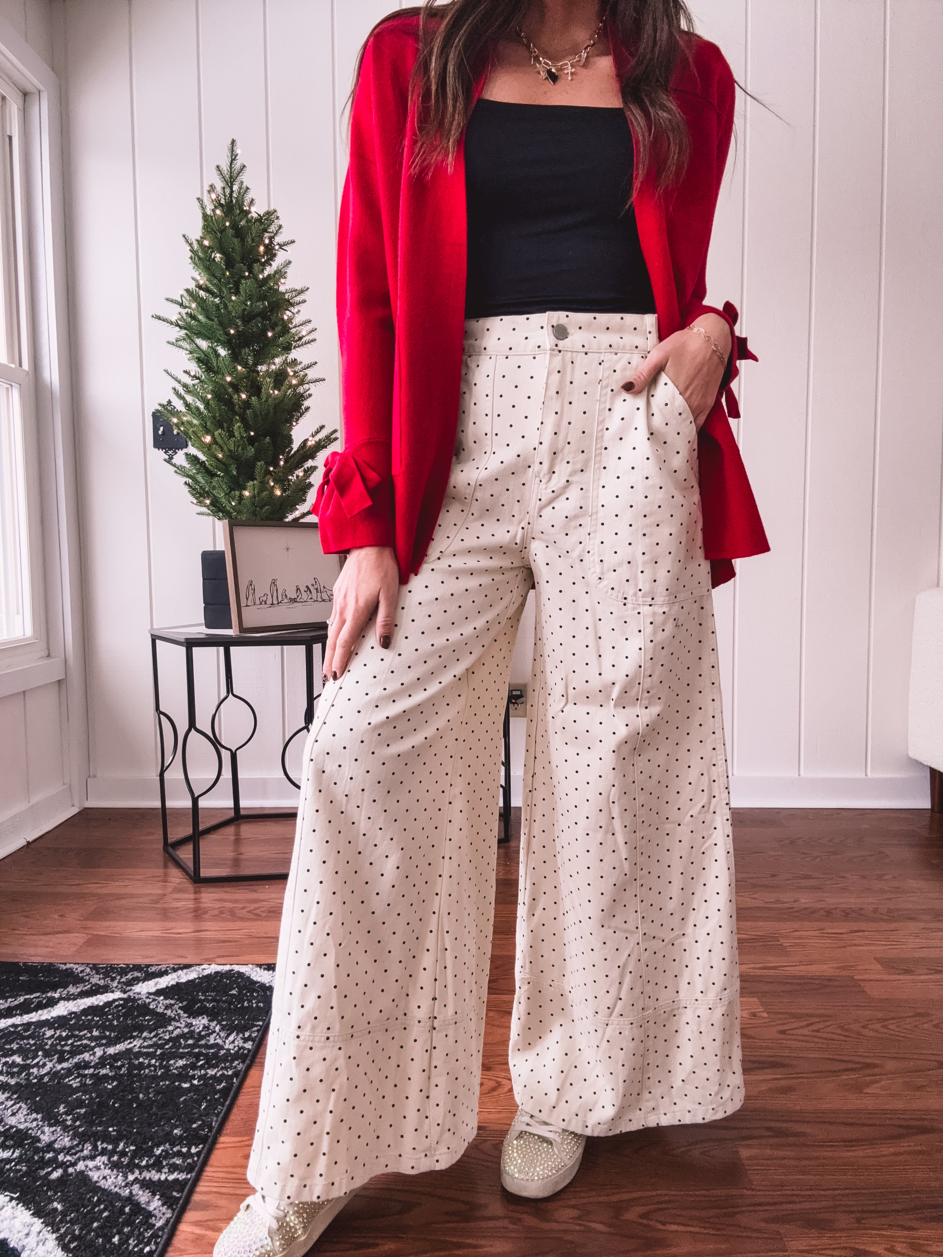 Wide leg button and zipper pants in ivory with black polka dots.