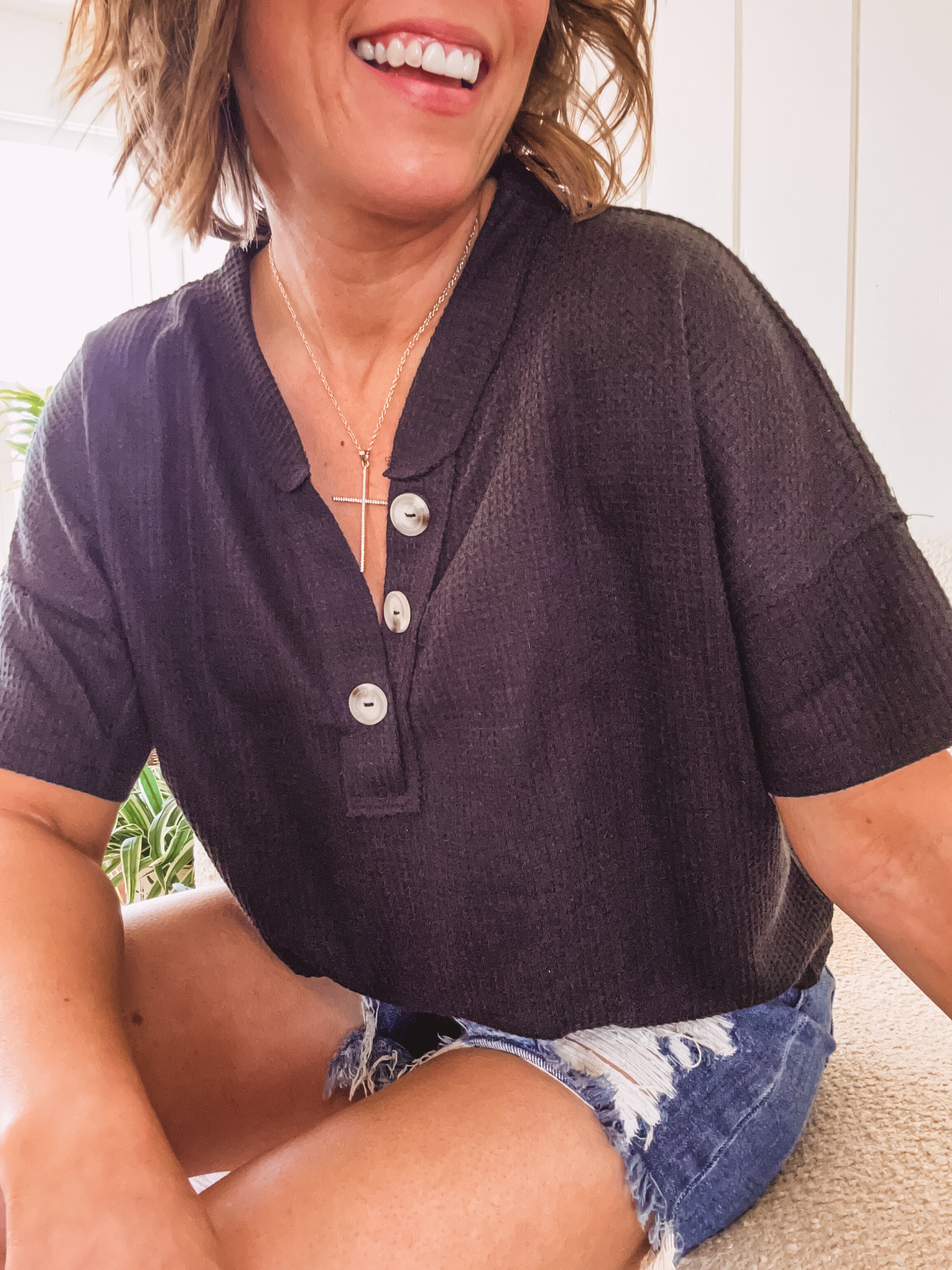 Lightweight waffle texture V neck tee with three buttons at neck.