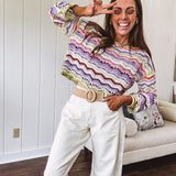Lightweight cropped crochet long sleeved round neck pullover in pink, white, sage, orange and purple wave design.
