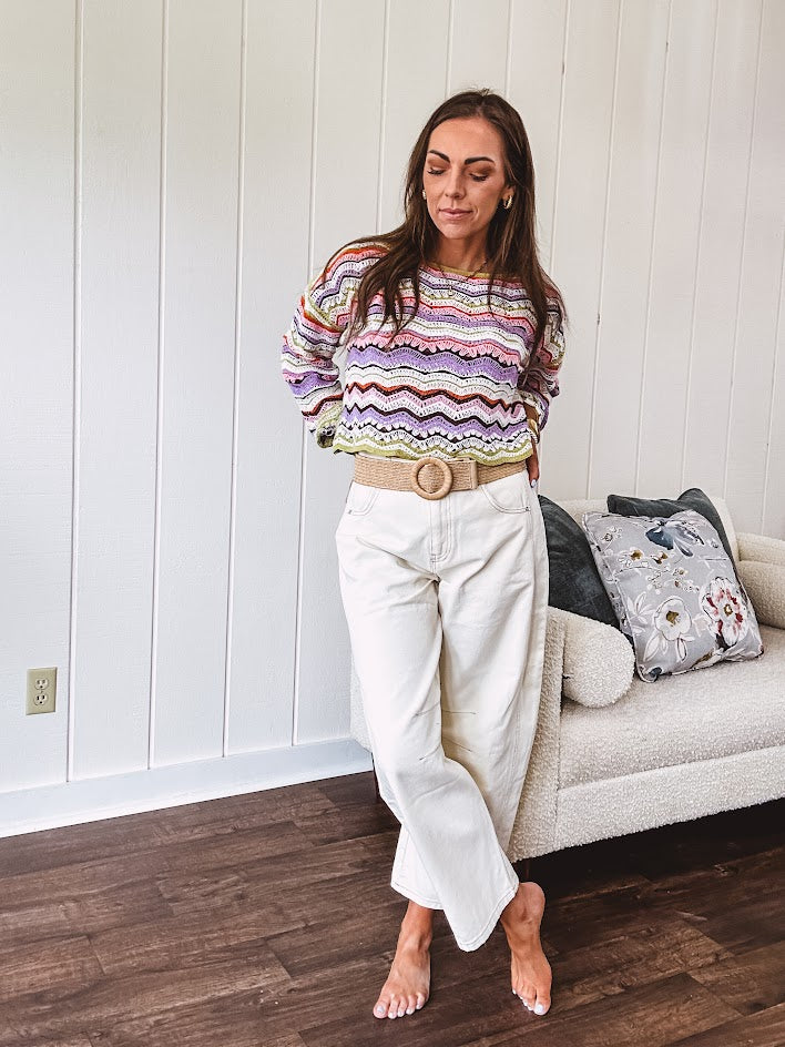 Ecru cropped wide leg pants with barrel stitching on the inner knees, contrast stitching and zero stretch.