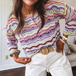 Lightweight cropped crochet long sleeved round neck pullover in pink, white, sage, orange and purple wave design.