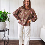 Thin chestnut brown boatneck crew with vintage inspired pink and green floral print and split front hem with exposed seams.