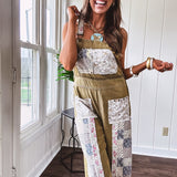 Light olive green washed cotton overalls with pastel floral patchwork throughout including on the adjustable traps with metal clasps and zippered sides.