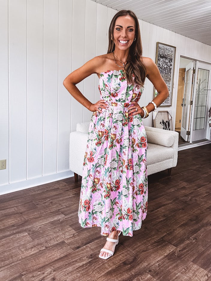 Pink strapless midi dress with floral and berry motif in red, blue and white with pleated front bodice and back smocked bodice, fully lined pleated skirt, with pockets.