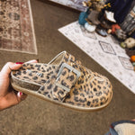 Leo print flat clog shoe with oversized buckle and western print and design.