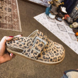 Leo print flat clog shoe with oversized buckle and western print and design.