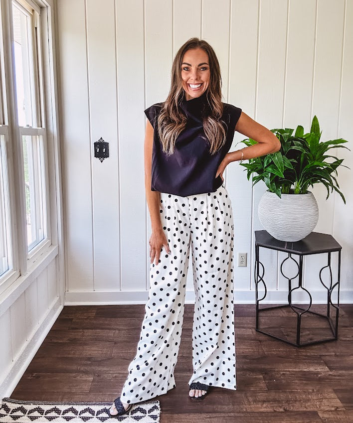 Wide leg, pleated front ivory and black polka dot pants with hidden elastic waist, side zip and pockets.