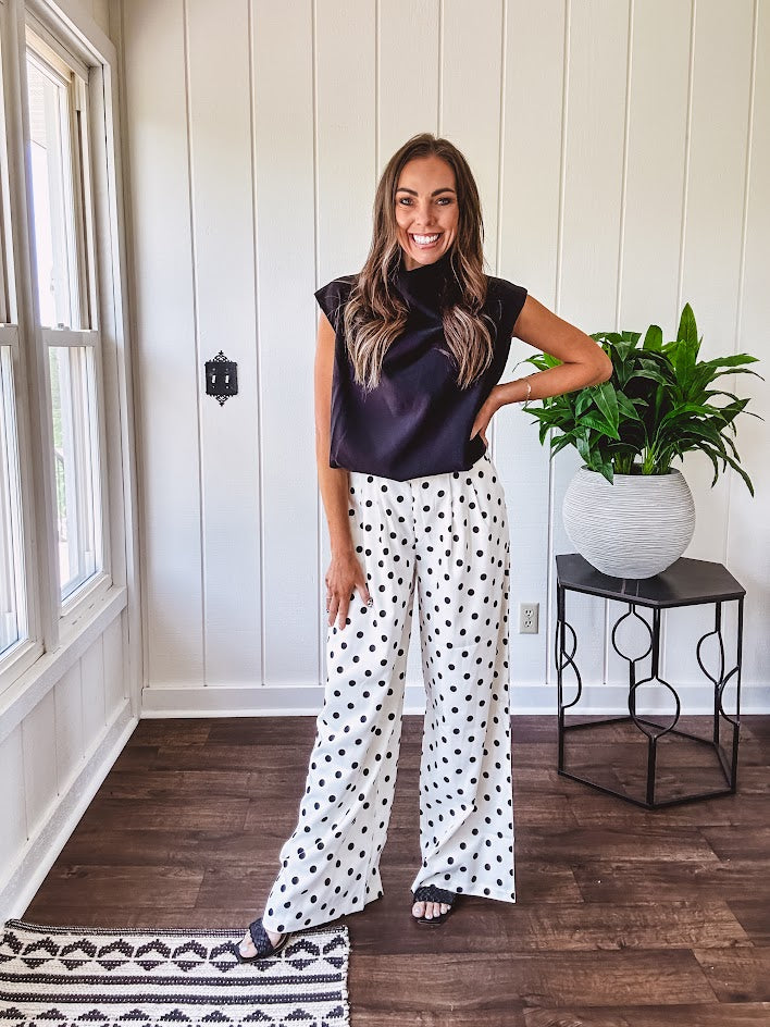 Wide leg, pleated front ivory and black polka dot pants with hidden elastic waist, side zip and pockets.