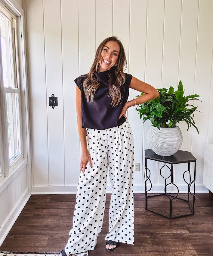 Wide leg, pleated front ivory and black polka dot pants with hidden elastic waist, side zip and pockets.