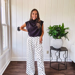 Wide leg, pleated front ivory and black polka dot pants with hidden elastic waist, side zip and pockets.