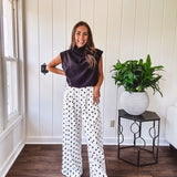 Wide leg, pleated front ivory and black polka dot pants with hidden elastic waist, side zip and pockets.
