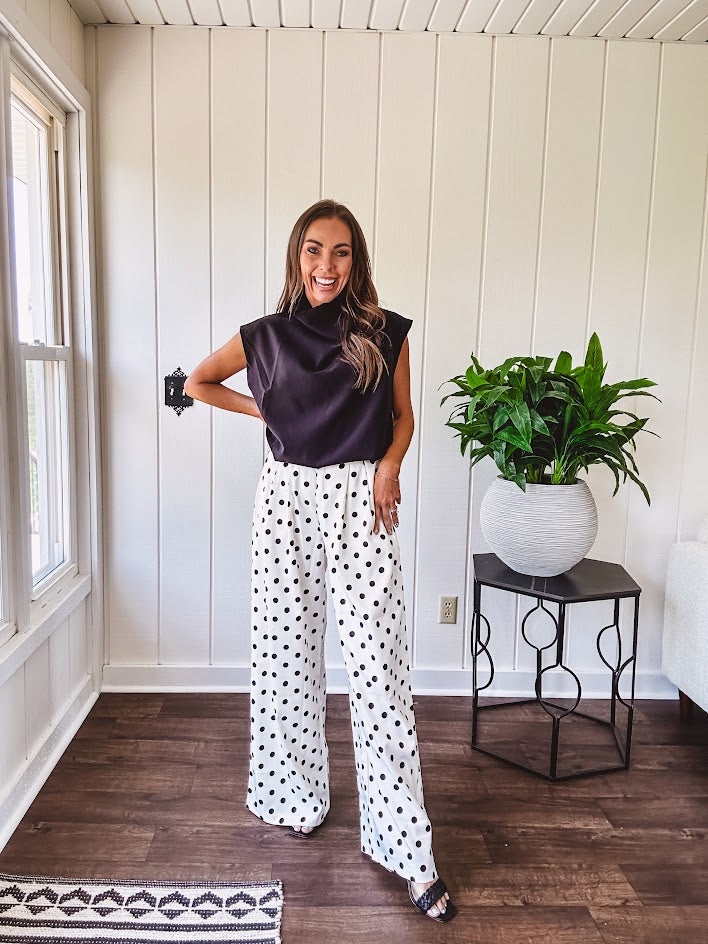 Wide leg, pleated front ivory and black polka dot pants with hidden elastic waist, side zip and pockets.