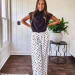 Wide leg, pleated front ivory and black polka dot pants with hidden elastic waist, side zip and pockets.