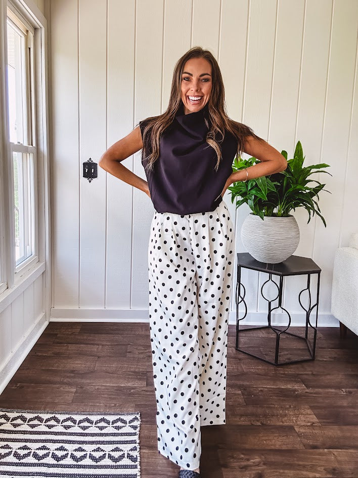 Wide leg, pleated front ivory and black polka dot pants with hidden elastic waist, side zip and pockets.