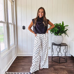 Wide leg, pleated front ivory and black polka dot pants with hidden elastic waist, side zip and pockets.