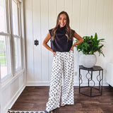 Wide leg, pleated front ivory and black polka dot pants with hidden elastic waist, side zip and pockets.