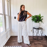 Wide leg, pleated front ivory and black polka dot pants with hidden elastic waist, side zip and pockets.