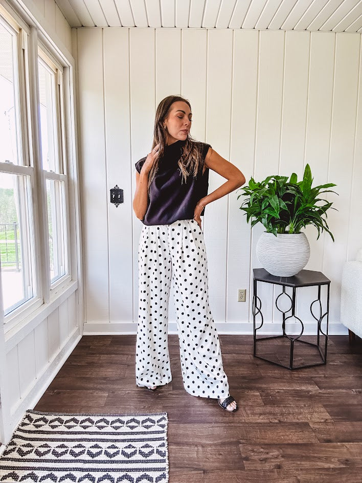 Wide leg, pleated front ivory and black polka dot pants with hidden elastic waist, side zip and pockets.