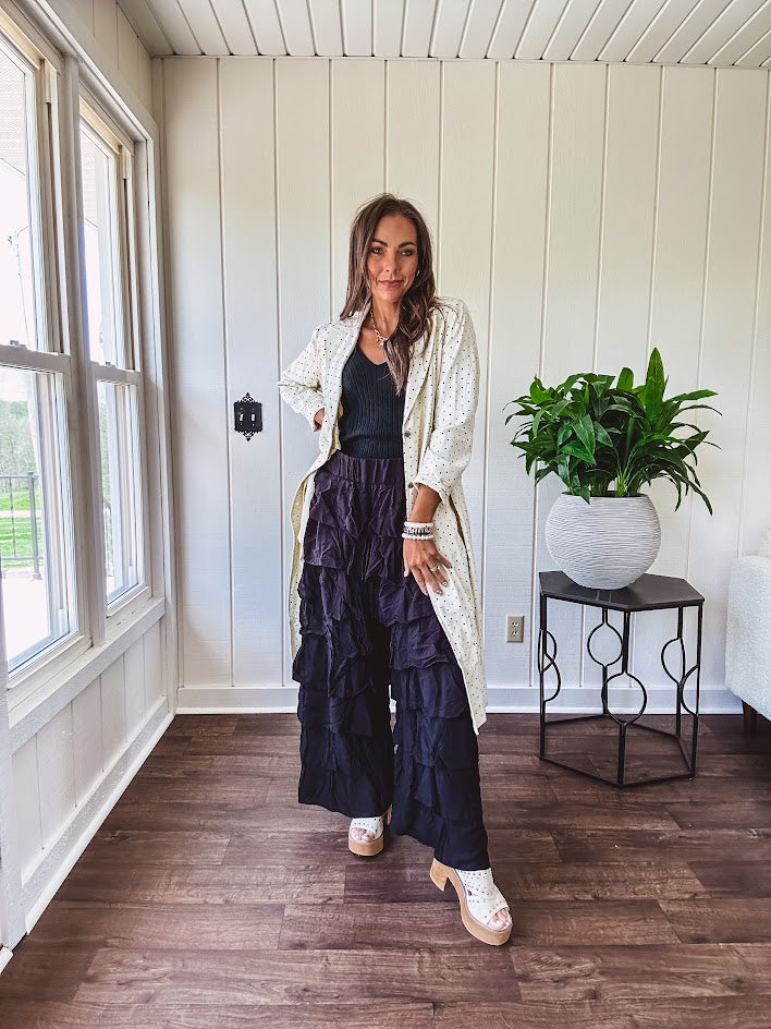 Black ruffled tiered pants, fully lined with elastic waist band.