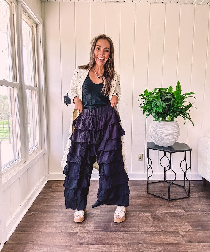 Black ruffled tiered pants, fully lined with elastic waist band.