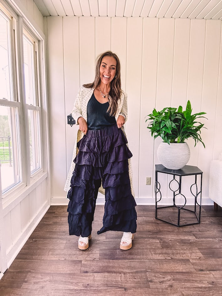 Black ruffled tiered pants, fully lined with elastic waist band.