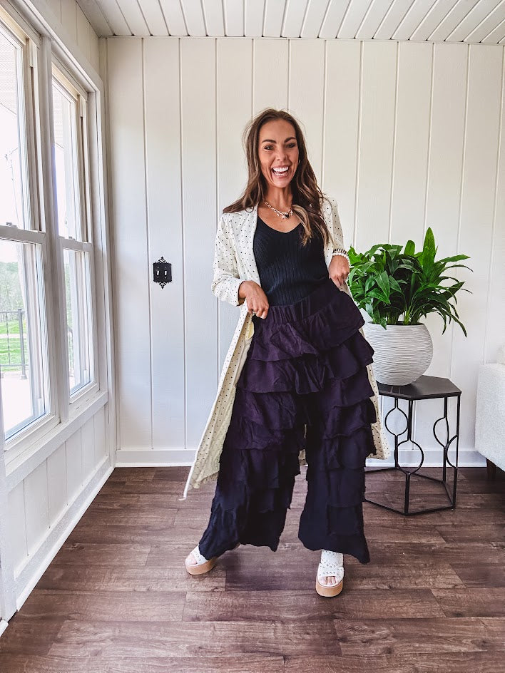 Black ruffled tiered pants, fully lined with elastic waist band.