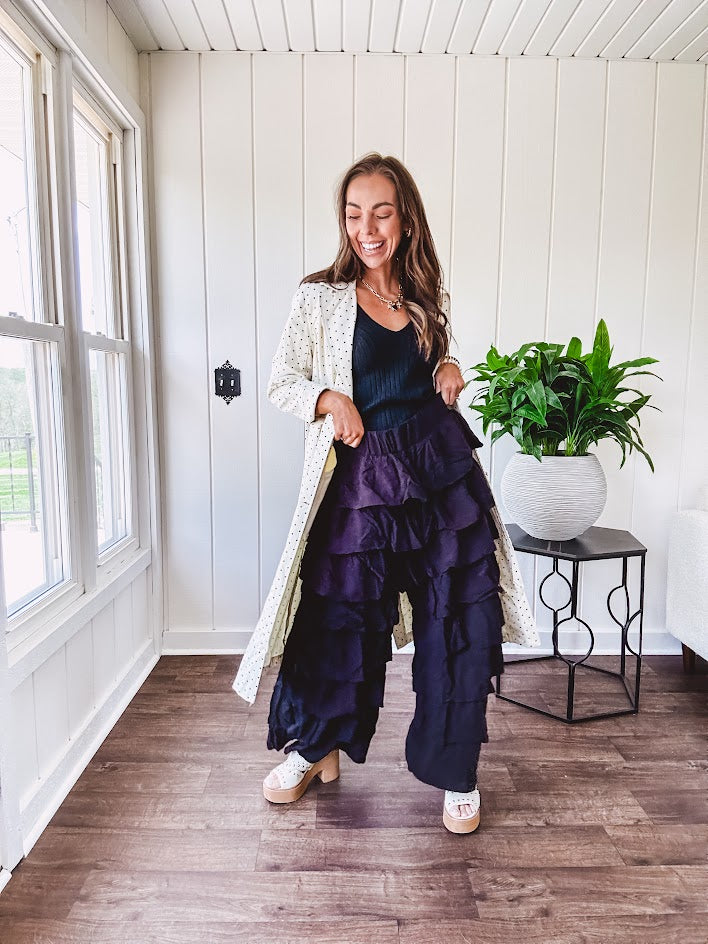 Black ruffled tiered pants, fully lined with elastic waist band.