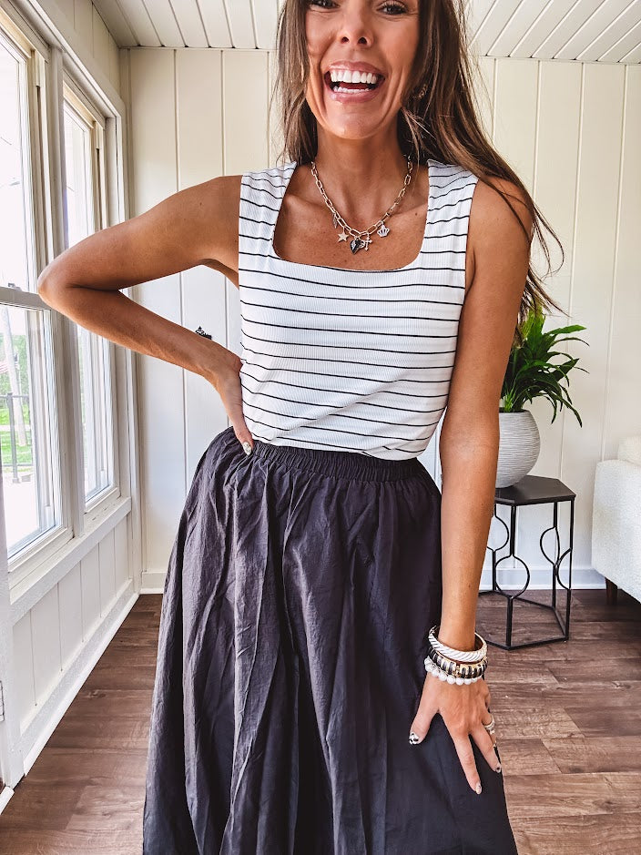 Soft and stretchy black and white striped tank with wide straps, square neckline and micro rib texture.