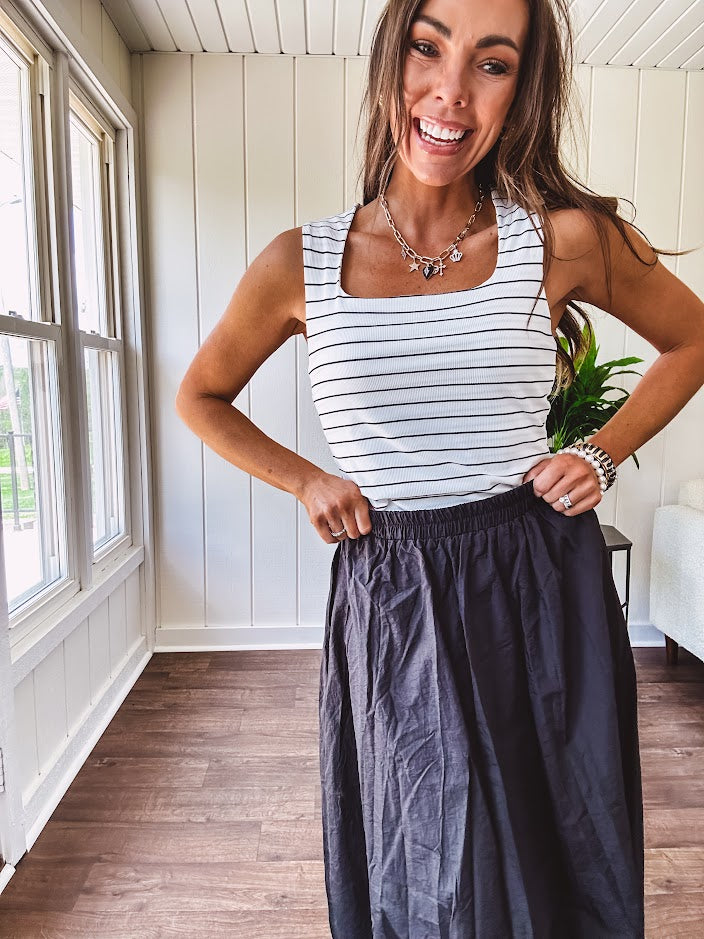 Soft and stretchy black and white striped tank with wide straps, square neckline and micro rib texture.