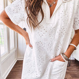 Lined cream denim-like short shift dress with V neck and collar, short sleeves,, contrasting tan stitching, front pocket and eyelet details throughout