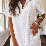 Lined cream denim-like short shift dress with V neck and collar, short sleeves,, contrasting tan stitching, front pocket and eyelet details throughout