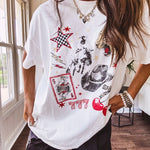 White oversized tee featuring a mixed print of black, red and cream in western, leo and playing card theme.