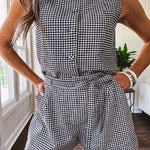 Sleeveless black and white gingham vest with fabric buttons down the front.