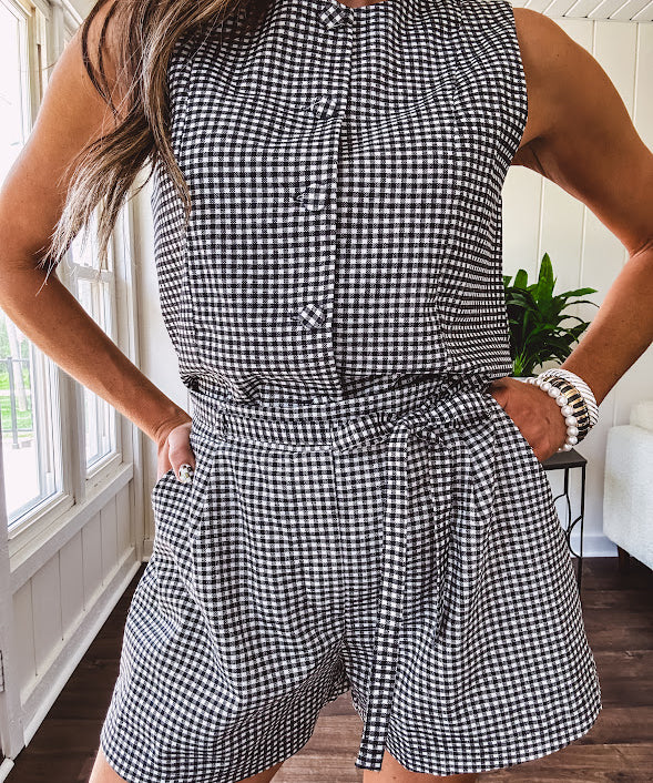 Lined black and white gingham shorts with matching belt, elastic back waist and pockets.