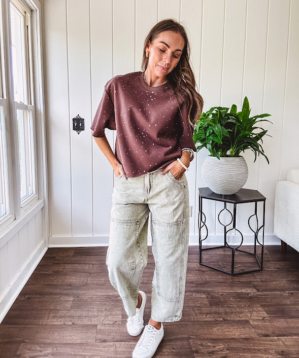 Cotton brown tee with a boxy cut and tie dyed underlayment peeking out of star cutouts, adorned with multicolor mini crystals.