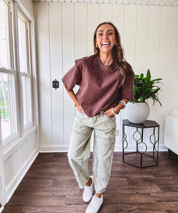 Cotton brown tee with a boxy cut and tie dyed underlayment peeking out of star cutouts, adorned with multicolor mini crystals.