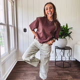 Mineral washed light olive denim barrel pants with carpenter design, side pockets and button and zipper closure with elastic back waist.