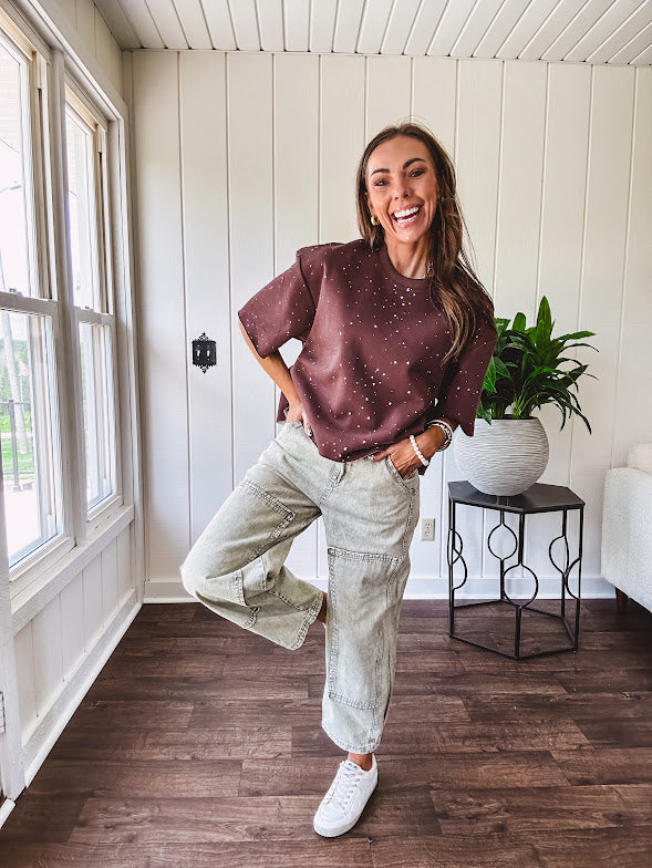 Mineral washed light olive denim barrel pants with carpenter design, side pockets and button and zipper closure with elastic back waist.