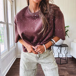 Cotton brown tee with a boxy cut and tie dyed underlayment peeking out of star cutouts, adorned with multicolor mini crystals.