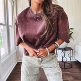 Cotton brown tee with a boxy cut and tie dyed underlayment peeking out of star cutouts, adorned with multicolor mini crystals.