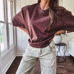 Cotton brown tee with a boxy cut and tie dyed underlayment peeking out of star cutouts, adorned with multicolor mini crystals.