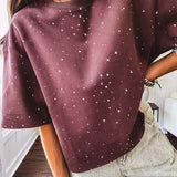 Cotton brown tee with a boxy cut and tie dyed underlayment peeking out of star cutouts, adorned with multicolor mini crystals.